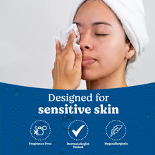 Huggies XL unscented wipe on a woman's face, with towel and wipe