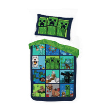 Minecraft comforter set with navy pillow and green top, featuring multi-scene pixel artwork
