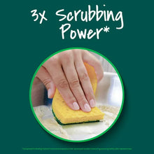 Yellow and green heavy-duty scrub sponge in use with hand