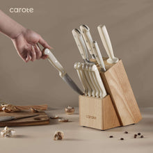14-piece knife set standing in wooden block with light handles