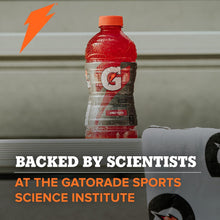 Gatorade Thirst Quencher sports drink bottle with red liquid and orange cap