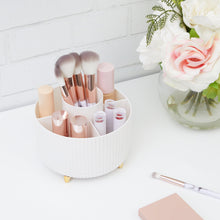 White rotating beauty organizer with makeup items and five compartments