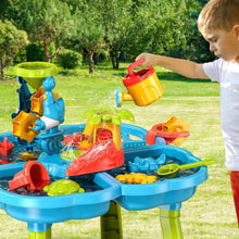 Kids sand and water table in yard with dinosaur waterwheel and multicolor toy shovels