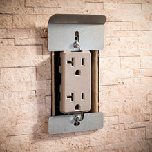 White outlet insert with open outlet cavity and metal mounting plate on bracket