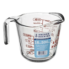 Clear glass measuring cup with 2-cup and 1/2-cup red measurement markings