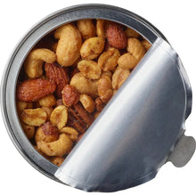 Metal container filled with honey roasted mixed nuts, peanuts and cashews