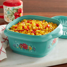 Teal plastic food storage container with lid filled with corn