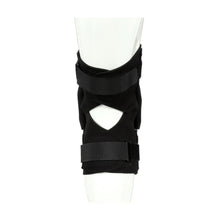 Black hinged knee brace worn on knee with front cutout opening
