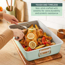 Mint green ceramic nonstick roaster pan with roasted chicken and vegetables