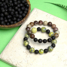 Beaded bracelets with clear stretch cord, dark and yellow bead mix