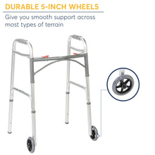Folding walker with large front wheels, grey aluminum frame, padded handrests