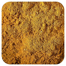 Ground turmeric and spices powder, golden-brown fine granules