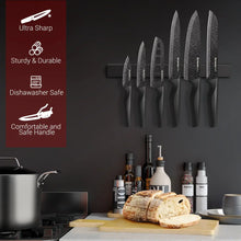 6-piece kitchen knife set with speckled black blades on a wall-mounted rack