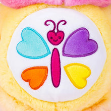 Calming heart bear plush belly patch with multicolor hearts on white center