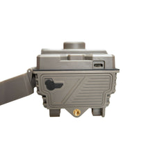 Cellular trail camera side port panel with USB-C opening, gray rugged body