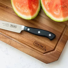 Acacia carving board with watermelon slices and VIKING logo beside chef knife