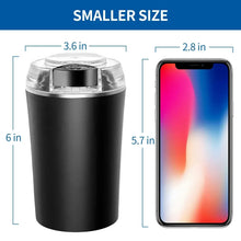 Black electric coffee grinder with transparent lid and stainless control button