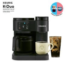 Black Keurig dual coffee maker with mug and iced coffee glass under spout