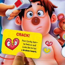 Operation game card reading "CRACK!" with cavity character face