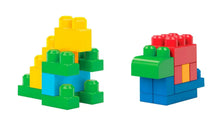 Colorful plastic building blocks showing two small structures in green, yellow, red, and blue