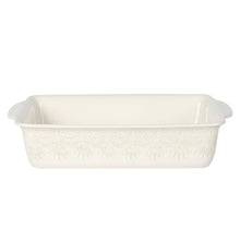 Rectangular ceramic casserole baking dish with embossed linen pattern and side handles