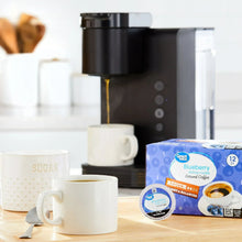 Great Value blueberry ground coffee pods with coffee cups on a counter