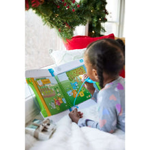 Child playing with a LeapFrog® LeapStart® learning system on a floor