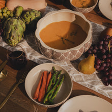 Stoneware soup tureen with cream lid and dark leaf pattern, open for serving