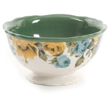 Floral soup bowl with green interior and blue/yellow rose pattern