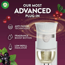 Air Wick plug-in scented oil warmer with clear oil reservoir in white housing