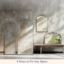 Four- size display of arch floor mirrors with ornate filigree frames and beaded borders