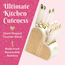 Heart-shaped knife block with white iridescent knives and gold-tipped handles