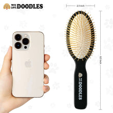 Black pet pin brush with gold pins, oval brush head and long handle