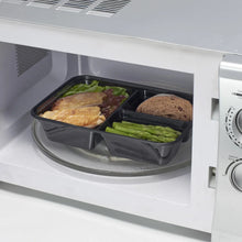 3-compartment meal prep container on microwave turntable with prepared food