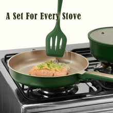 Green nonstick skillet on gas burner with utensil resting inside