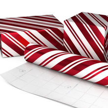 Hallmark candy cane stripe gift wrap roll beside wrapped boxes