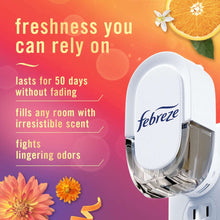 White Febreze plug-in air freshener oil refill unit with hinged cover and prongs
