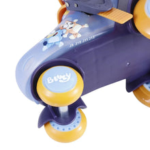 Roller skate wheel and boot detail, light blue frame with yellow wheels and logo