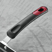Nonstick fry pan handle with red end cap and black grip over riveted aluminum