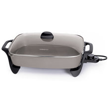 Electric ceramic skillet with glass lid, black handles and base, power cord attached