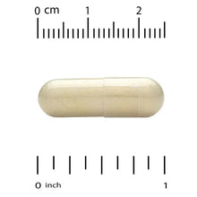 Cream softgel capsule on measurement scale