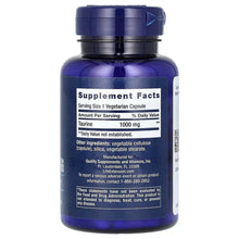 Taurine 1000 mg Supplement Facts label on dark blue bottle with black cap