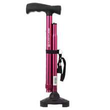 Folding cane detail view with black wrist strap and red metallic T handle