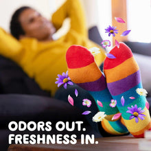 Laundry freshness slogan over colorful striped socks: "ODORS OUT. FRESHNESS IN."