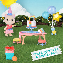 Dollhouse birthday set with small unicorn doll, party cake table, balloons, and gift box