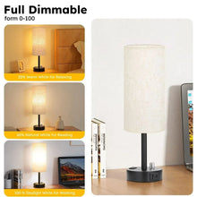 Bedside table lamp with off-white linen shade and black base, charging ports