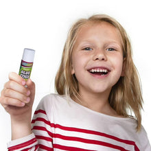Clear glue stick with white cap in a child’s hand
