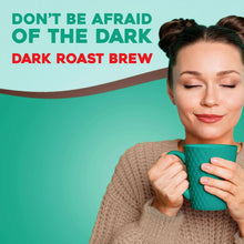 Dark roast coffee cup held by person, with pod label