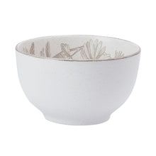 Floral stoneware bowl with speckled white finish and gray botanical pattern on rim