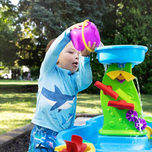 Kids' splash water table with purple scoop and red sprayer on green panel